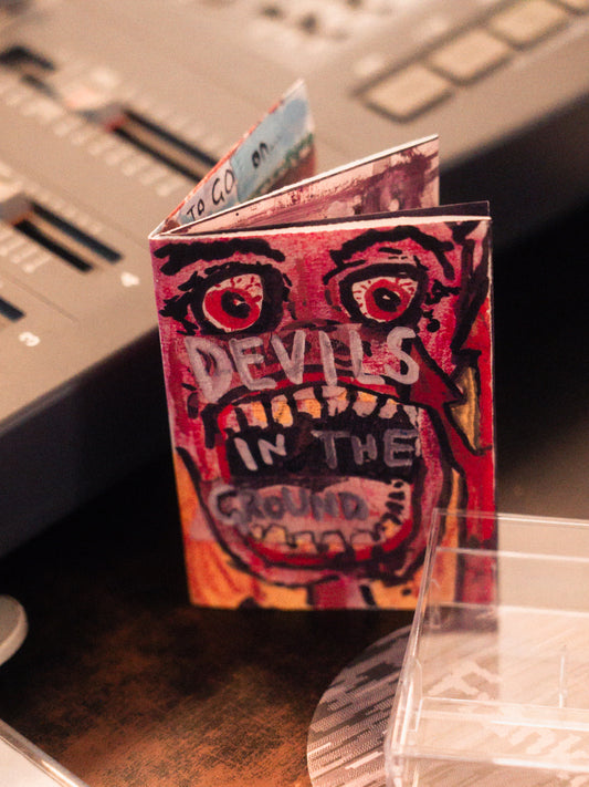 Devils In The Ground — Double A-Side Cassette + Mini Zine